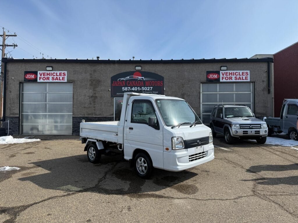 Front exterior view of a 2006 Subaru Sambar Dump Truck for sale at Japan Canada Motors.