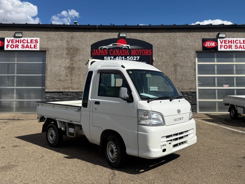 Driver side exterior view of a 2009 Daihatsu Hijet Jumbo 4WD for sale at Japan Canada Motors, 55 Superior Street, Devon, Alberta. Call 587-401-5027.